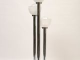 pair of chrome plated floor lamps with frosted glass shades