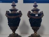 three vases sitting on a table in front of a window