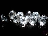 some very pretty white diamonds on a black surface