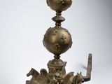 an image of a metal object with a horse on top of it