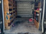the back of a van with the door open and the back of the van with the door open
