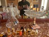 a man that is taking a picture in the mirror