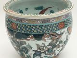 a blue and white vase with a dragon design on it