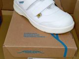 a box with a pair of shoes on it and a pair of shoes on the box