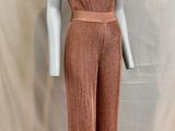 a mannequin wearing a pink jumpsuit with a halt