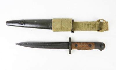 two knifes are laying next to each other on a white surface