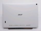 the back of a white laptop computer sitting on top of a table