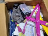 a cardboard box filled with assorted items on the floor