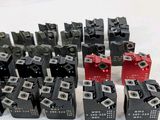 a lot of black and red switches on a white surface