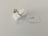 a small white box with a ring on top of it