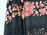 an image of a black dress with pink and yellow flowers on it