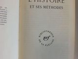 an open book with a picture of a clock on it