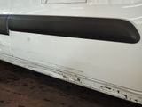 a white van with a black stripe on the side of it
