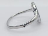 a close up of a ring on a white surface
