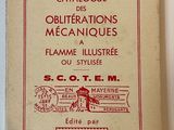 an old book with a red and white cover sitting on a table