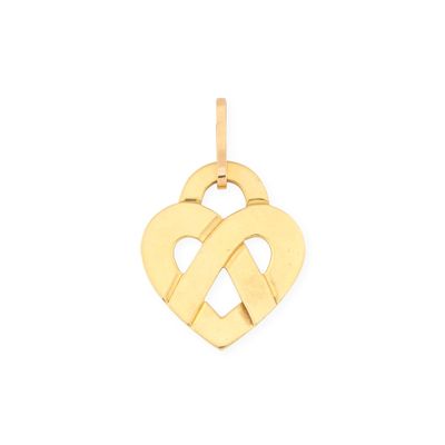 un pendentif en forme de cœur en or avec un nœud au milieu