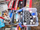 many different types of tools in a box on the ground