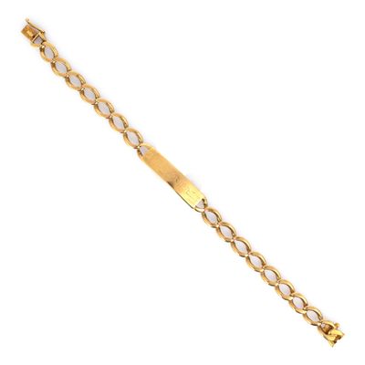 un bracelet plaqué or avec un maillon ovale sur fond blanc