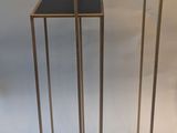 two tables that are standing next to each other