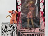 a doll that is in a box next to a box