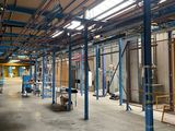 a large warehouse with a lot of equipment inside of it