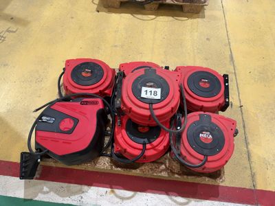several red and black fire hydrant sitting on top of a wooden pallet