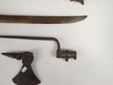 two old tools that are sitting on a white surface