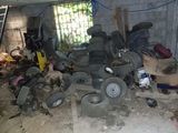 a pile of tires and other items in a garage