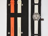 an image of a watch and a watch case on a white surface
