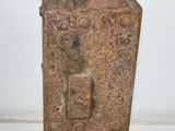 a rusted metal box with a light switch on it