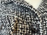 the back of a mannequin dress with a black and white pattern on it