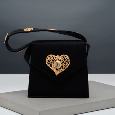 black velvet bag with gold heart broochet