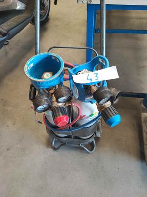 an image of a small engine on a cart in a garage