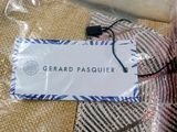 a label that says gerard pasquer on a piece of fabric
