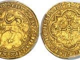 a gold coin with an image of a man on it
