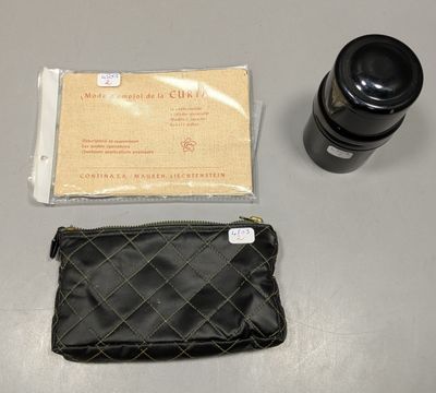an image of a camera and a wallet on a table