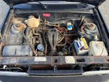 an old car with its hood open and the engine in the trunk