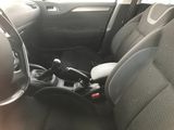 dashboard of a car with a steering wheel and a shift button