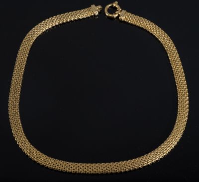 a gold chain necklace with a clasp on a black background