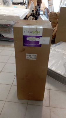 a cardboard box sitting on the floor in a room