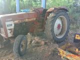 a tractor that is sitting in the dirt