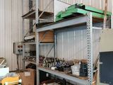 a large room with a lot of shelves and a lot of tools