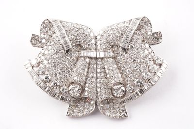 an image of a diamond bow broochle on a white background
