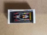 a box with a toy car in it on a table