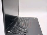 a laptop with a black keyboard on a white surface