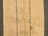 an old piece of paper with writing on it sitting on top of a table