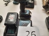 a lot of power tools on a table with a price tag