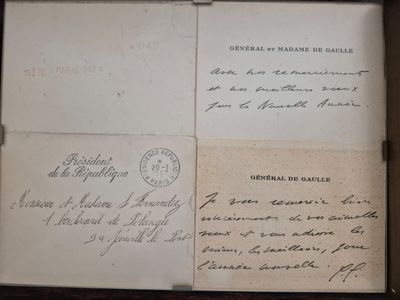 an old book with writing on it sitting on a table