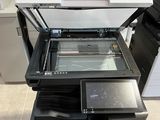 the printer is sitting on top of the counter in the kitchen