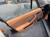 a car door with the door handle open and the driver ' s side door open